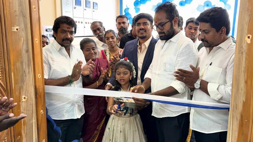 Guests cut the ribbon at the entrance of a new branch