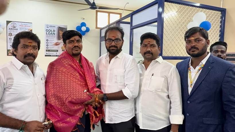 A guest is honoured with a shawl at the branch opening